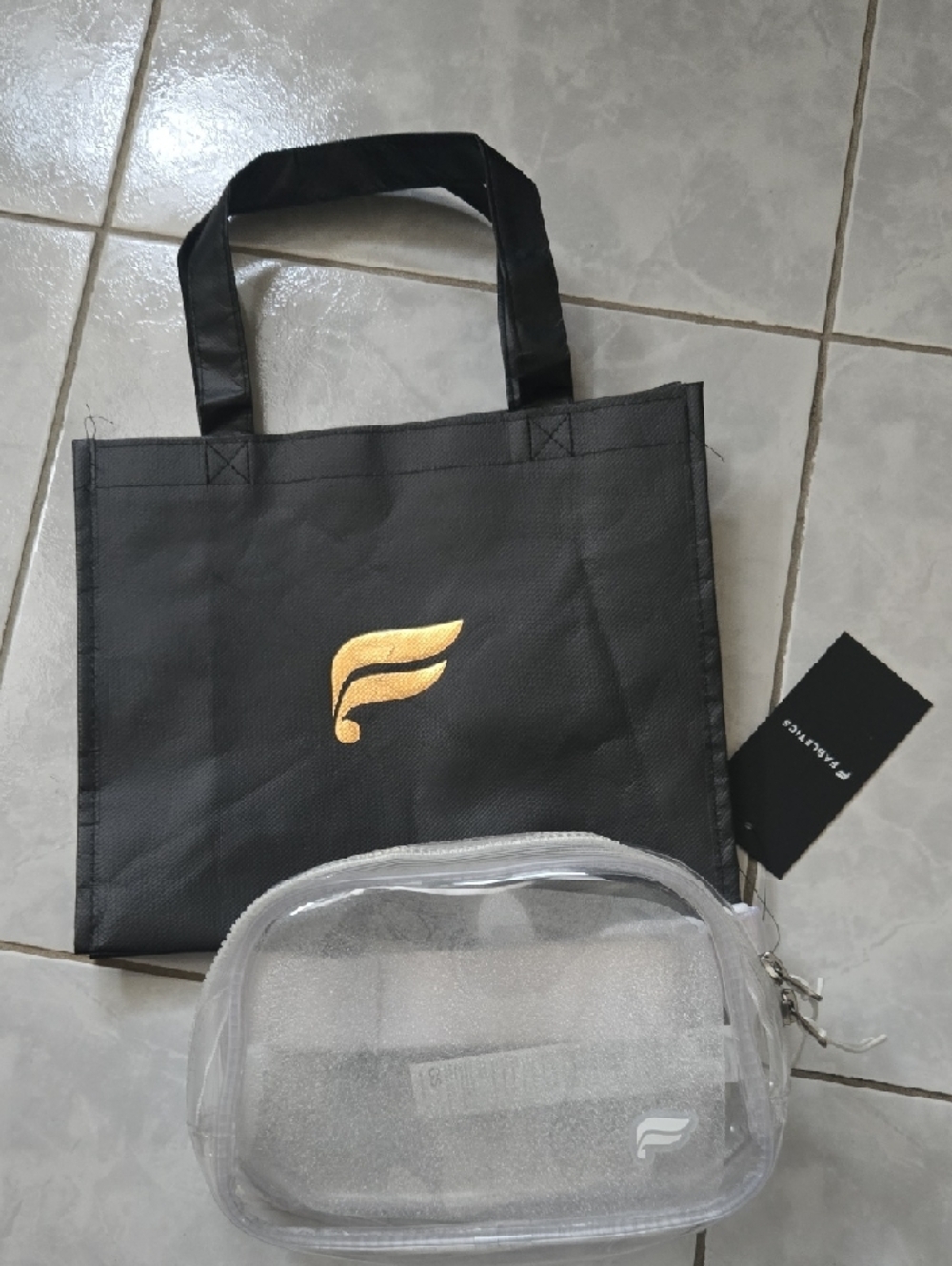 Fabletics Clear PVC Travel Pouch with White Logo and Reusable Bag